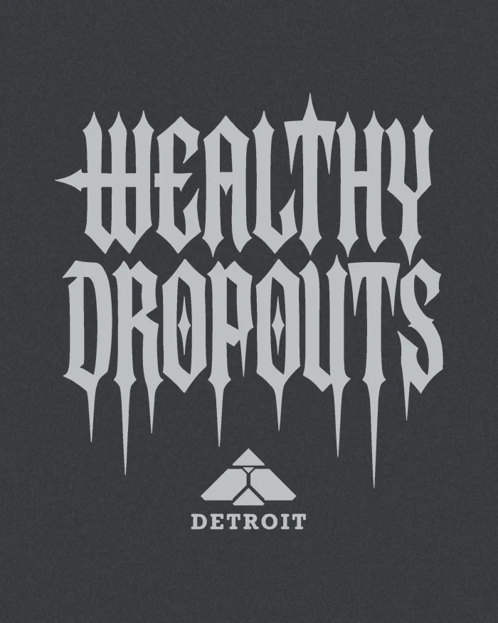 The back print artwork in silver on charcoal heather: WEALTHY DROPOUTS, the pyramid mark and DETROIT